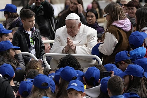 Pope Francis meets children at the end of his weekly general audience in St. Peter's Square, at the Vatican on Wednesday, March 29, 2023. (Photo | AP)