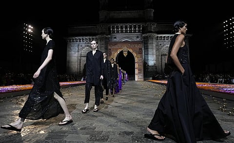 Models display creations for the Dior Pre-Fall 2023 collection at the Gateway of India landmark monument in Mumbai, India on Thursday, March 30, 2023. (Photo | AP)