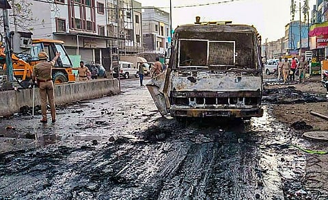 Charred remains of a vehicle after a clash between two groups near a Ram temple in Aurangabad, on March 30, 2023. (Photo | PTI)