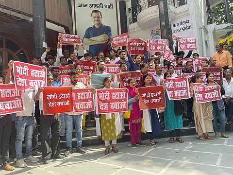 AAP workers at a protest in Lucknow carrying placards saying 'Modi Hatao Desh Bachao'. (Photo | Sanjay Singh AAP Twitter)