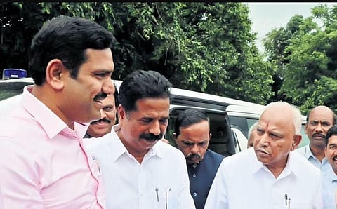 Ex-Karnataka CM B S Yediyurappa with his son B Y Vijayendra (left) in Shikaripura. (Express)