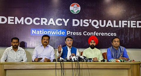 Congress Media and Publicity Chairman Pawan Khera (C),MPCC Chief Spokesperson Atul Londhe (L) and AICC spokesperson Charan Singh Sapra on the disqualification of Rahul Gandhi from Lok Sabha. (Photo |
