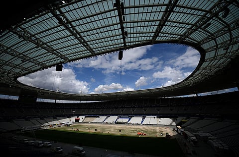 This file photo taken on May 24, 2022, shows the Stade de France staff install a new hybrid pitch at the Stade de France, in Saint-Denis, outside Paris. (Photo | AFP)