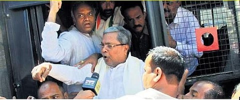 Opposition leader Siddaramaiah being taken into custody during a protest rally against corruption in Bengaluru on Saturday| Express
