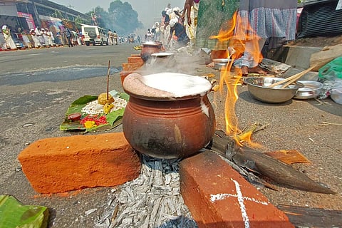 Thousands of women devotees from various parts of the state prepared 'pongala' on brick hearths lining the roads of the capital city Thiruvananthapuram to celebrate 'Attukal Pongala', which is arguably the largest festival for women in the world. (Photo | B P Deepu, EPS)