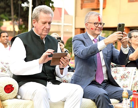 Australian Prime Minister Anthony Albanese (R) takes part in Holi celebrations, at Raj Bhavan, in Gandhinagar on Wednesday. (Photo | ANI)