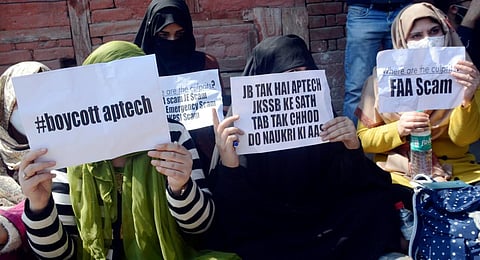 Jammu and Kashmir Services Selection Board (JKSSB) aspirants stage a protest against the purported grant of contract to APTECH Limited.(Photo | PTI)