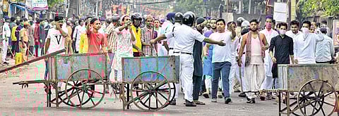 Security personnel cordon off an area after clashes between two groups during a Ram Navami procession the previous day, in Howrah district on Friday. (Photo | PTI)