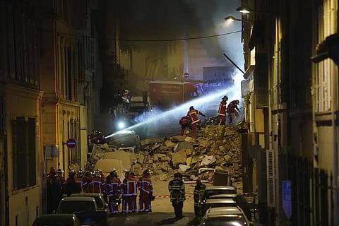 Firefighters work after building collapsed early Sunday, April 9, 2023 in Marseille, southern France. (Photo | AP)