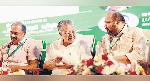Chief Minster Pinarayi Vijayan shares a moment with Industries Minister P Rajeeve at the venue of the ‘Year of Enterprises 2.0’ event in Kochi.