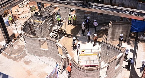 Workers at the construction of the new Ulsoor Bazaar post office building using 3D printing technology in Bengaluru.(Photo | Express)