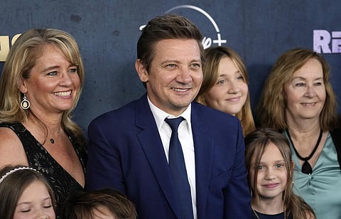 Jeremy Renner, the host and executive producer of 'Rennervations,' is surrounded by family members at the premiere of the four-part Disney+ docuseries. (Photo | AP)