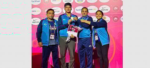 Priya Malik with her coaches | special arrangement