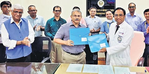 IIT-BBS director Shreepad Karmalkar and AIIMS Bhubaneswar executive director Dr Ashutosh Biswas at the MoU signing ceremony in Bhubaneswar. (Photo | Express)