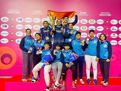 India's women wrestlers with their coaches and support staff. (Photo | Express)