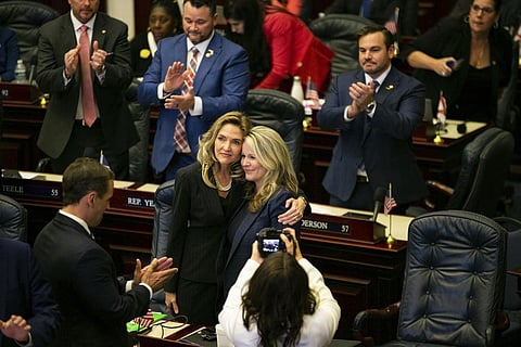 State Reps. Jennifer Canady, left, and Jenna Persons-Mulicka embrace after the Republican-dominated Legislature on approved a ban on abortions after six weeks of pregnancy. (Photo | AP)