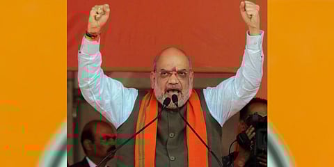 Union Home Minister Amit Shah addresses during a public meeting, at Suri in Birbhum district, Friday, April 14, 2023. (Photo | PTI)