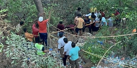 Rescue operations underway after a bus fell into a ditch in Raigad's Khopoli area. (Photo | ANI)