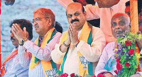 CM Basavaraj Bommai and BJP candidate Govind Karjol greet people in Mudhol on Tuesday. Karjol filed his papers to fight the May 10 polls on Tuesday