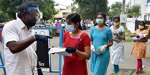 In this October 2021 representational image, security personnel checking the documents of a medical aspirant outside a NEET Examination centre in Coimbatore. (Photo| EPS)