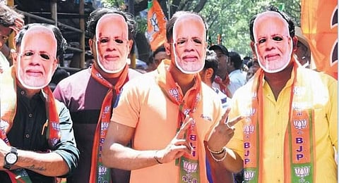 BJP supporters campaign for the party in Bengaluru on Tuesday | Express