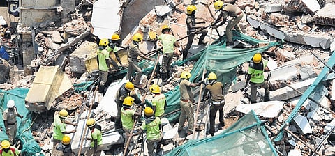 Fire and rescue services personnel removing debris at a collapsed building site near Parry’s | Ashwin Prasath, P Jawaahar