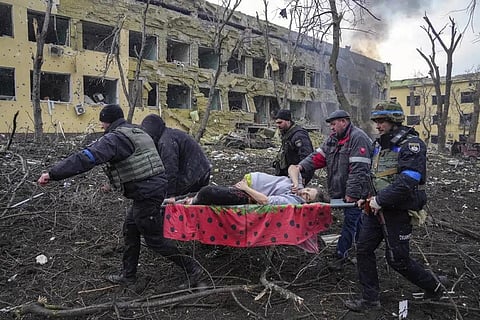 FILE- Iryna Kalinina, 32, an injured pregnant woman, is carried from a maternity hospital that was damaged during a Russian airstrike in Mariupol, Ukraine, on 9 March 2022. (Photo | AP)