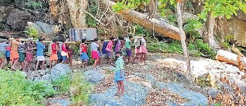 ​  The inverter and batteries being carried to the Thazhe Thuduki settlement in Attappadi  ​