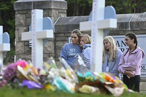 FILE PHOTO | Students at a nearby school pay respects at a memorial for the people who were killed, at an entry to Covenant School, Tuesday, March 28, 2023, in Nashville. (Photo | AP)