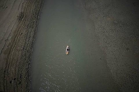 FILE PHOTO | A paddle boarder passes through a drying portion of the Verdon Gorge in southern France, Aug. 9, 2022. (Photo | AP)