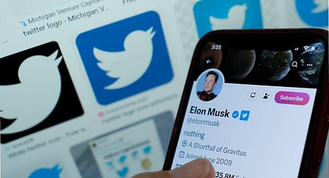This photo shows Elon Musk's blue tick next to his name on a smartphone. (Photo | AFP)