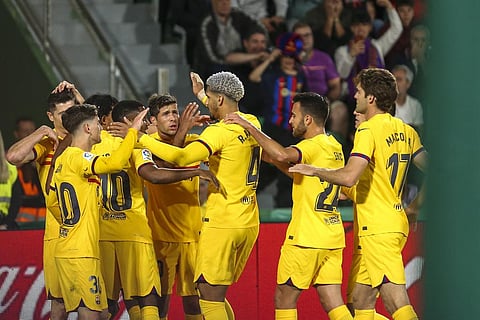 Representational Image: Barcelona's Robert Lewandowski celebrates with teammates after scoring his side's opening goal during a Spanish La Liga soccer match. (Photo | AP)
