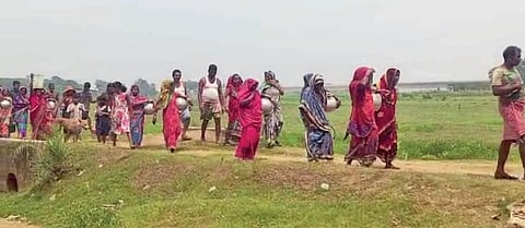Villagers of Chhoti carrying pitchers to collect water from Birupa river | Express