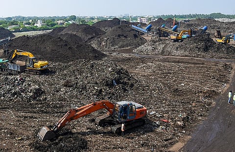 Bio-mining work under way at the Ariyamangalam dump yard in Tiruchy. (Photo | M K Ashok Kumar)