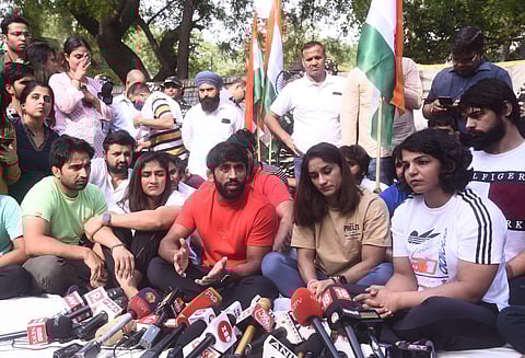 Wrestlers Bajrang Punia, Vinesh Phogat and Sakshi Malik return to Jantar Mantar to protest against the WFI President, in New Delhi on Sunday. (Photo | Parveen Negi, EPS)