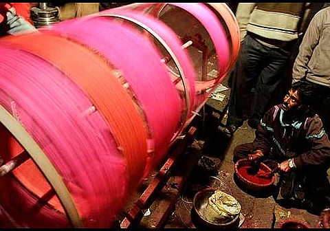 A man preparing kite strings. Image used for representational purpose | AP AP