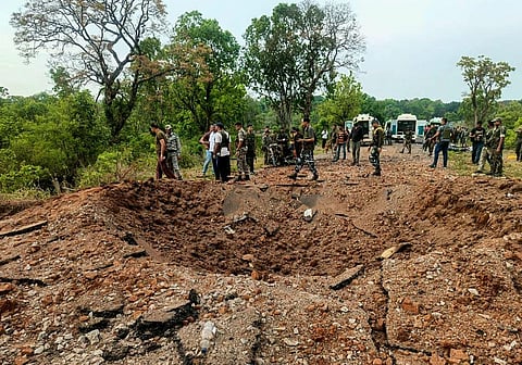 Security personnel at the site after at least ten police personnel and a driver were killed in a blast carried out by Naxalites in Chhattisgarh's Dantewada district. (Photo | PTI)