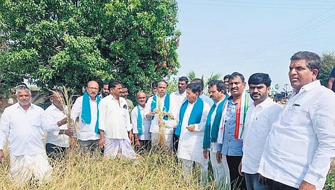 Congress leader P Sudharshan Reddy interacts with farmers at Mylaram village in Dharpally mandal under Nizamabad Rural Assembly constituency on Thursday