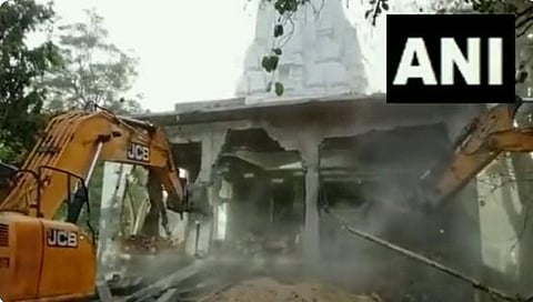 Indore municipality deploys bulldozer & demolishes illegal structure at Indore temple (Photo | ANI Twitter)
