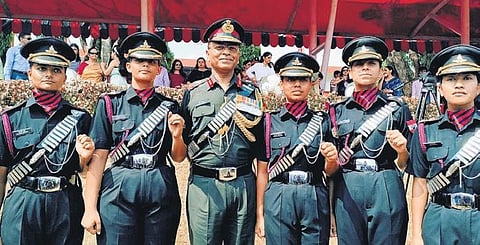 The newly-commissioned woman officers with Lt General Adosh Kumar, the designated DG of Artillery, after their passing out parade on Saturday | express