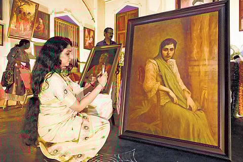 A visitor takes a photo of ‘The Parsi Lady’, the unfinished painting by Raja Ravi Varma which was unveiled by Governor Arif Mohammed Khan at the Kilimanoor Palace on Saturday | Vincent Pulickal