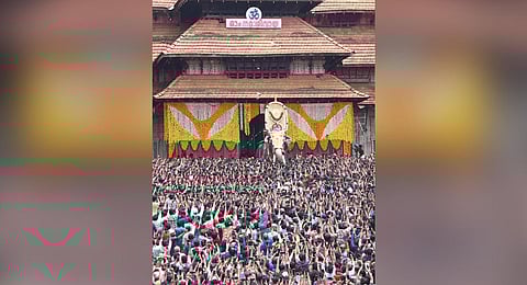 Tusker Ernakulam Sivakumar carrying the idol of Neythalakkavu Bhagavathy at the south entrance of the Sree Vadakkumnathan temple. | S LaL