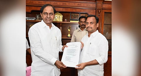 Chief Minister K Chandrasekhar Rao hands over the appointment order to Gellu Srinivas Yadav on Tuesday