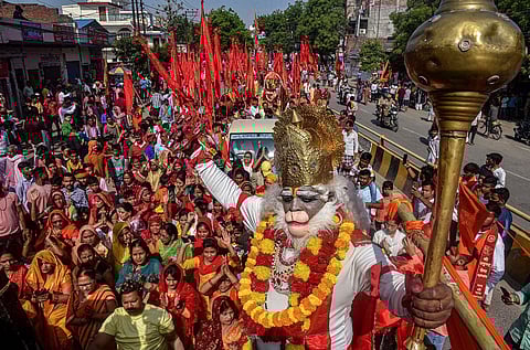 A devotee dressed as Lord Hanuman takes part in a religious procession on the occasion of 'Hanuman Jayanti', in Varanasi, Thursday, April 6, 2023. (Photo | PTI)