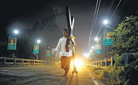Madan, a Tamil fisherman working at Munambam harbour,  on his way from Kochi to Malayattoor /TNIE captures scenes from the Malayattoor pilgrimage.