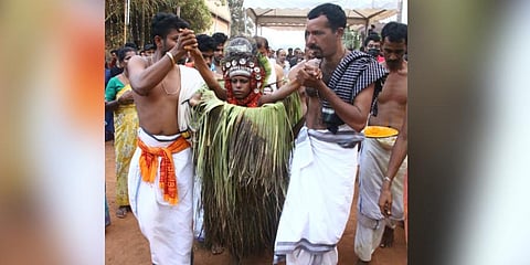 14-year-old being dragged out from bonfire after his theyyam performance. (Photo | Express)
