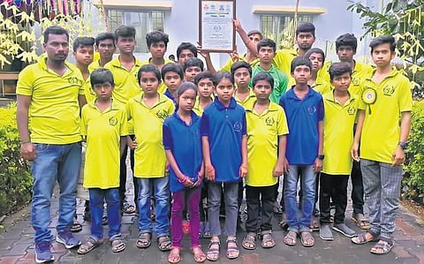 Govindasamy, along with 60 children from Padi in Dharmapuri, planted over 5000 saplings in four years | Express