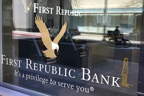 First Republic Bank signs and logos are attached to a window at a branch location, Wednesday, April 26, 2023, in Boston. (Photo | AP)