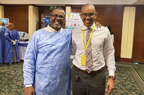 This image provided by Dr. Mohamed Eisa shows Dr. Bushra Ibnauf Sulieman, a Sudan-born American citizen, left, posing for a photo with Eisa. (Photo | AP