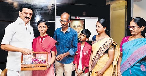 Nandhini being felicitated by Chief Minister MK Stalin on Tuesday. She was accompanied by her parents, younger brother and school headmistress | Express